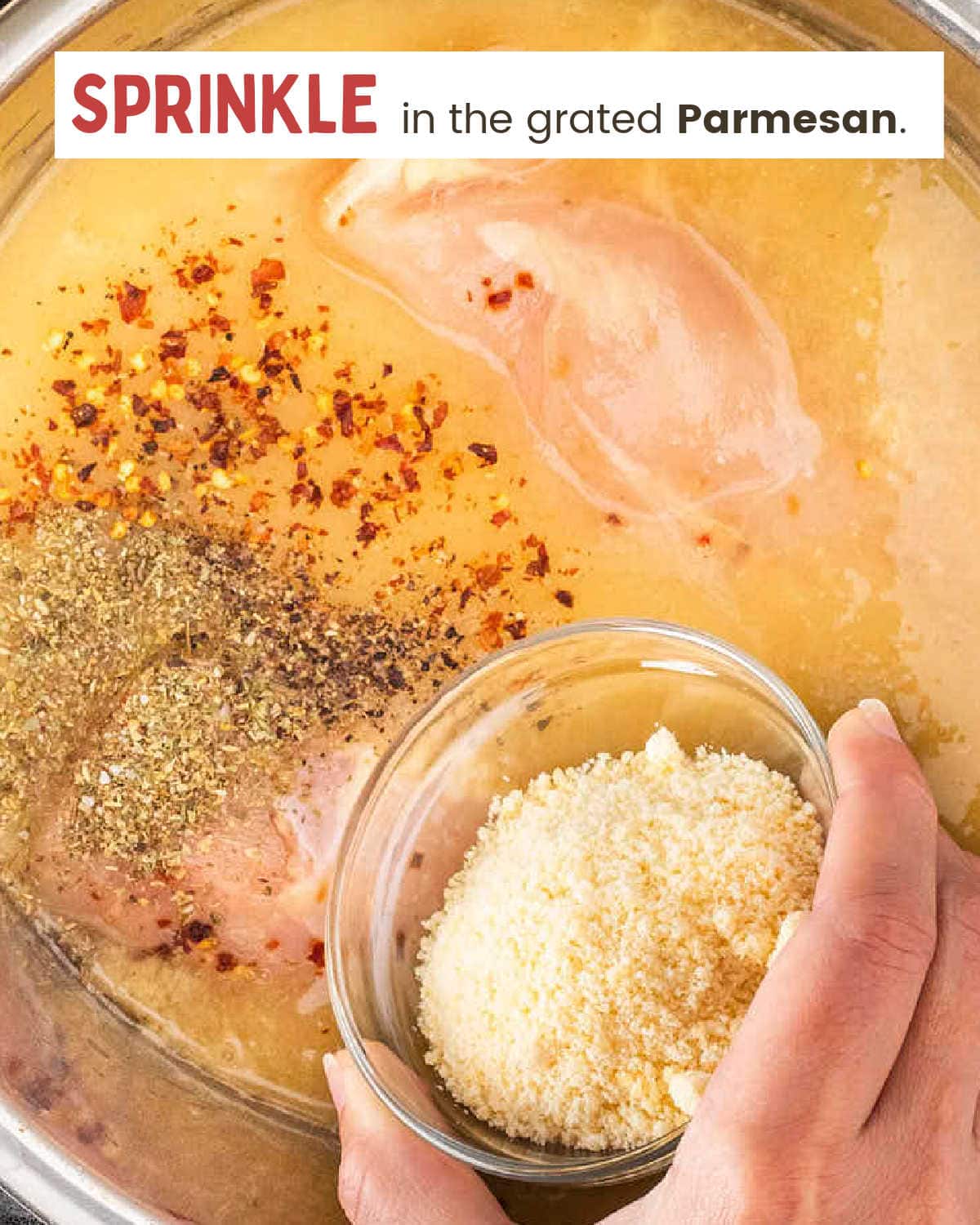 Sprinkle grated Parmesan cheese and spices on chicken pasta dish.