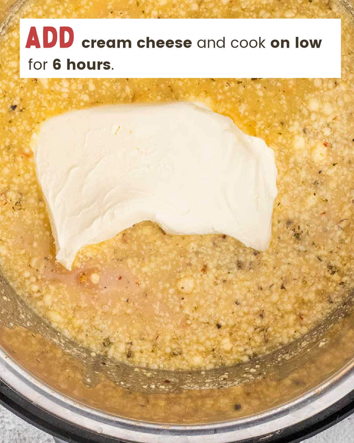 A block of cream cheese on top of the sauce before cooking.