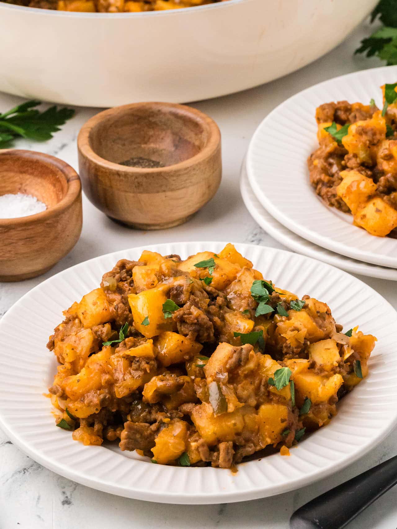 Serving of Ground Beef and Potatoes on a white plate.