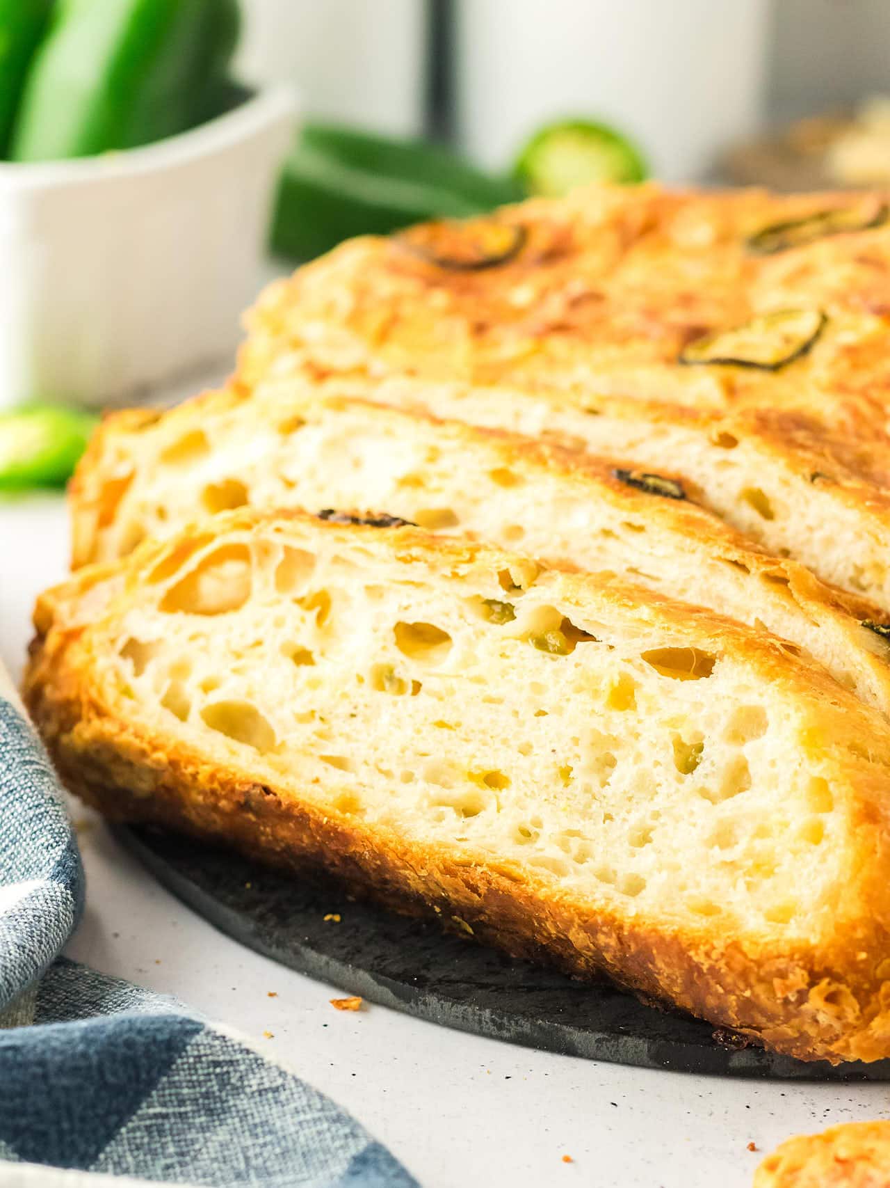 Close-up of Jalapeño Cheddar Bread slices with a crisp golden crust.