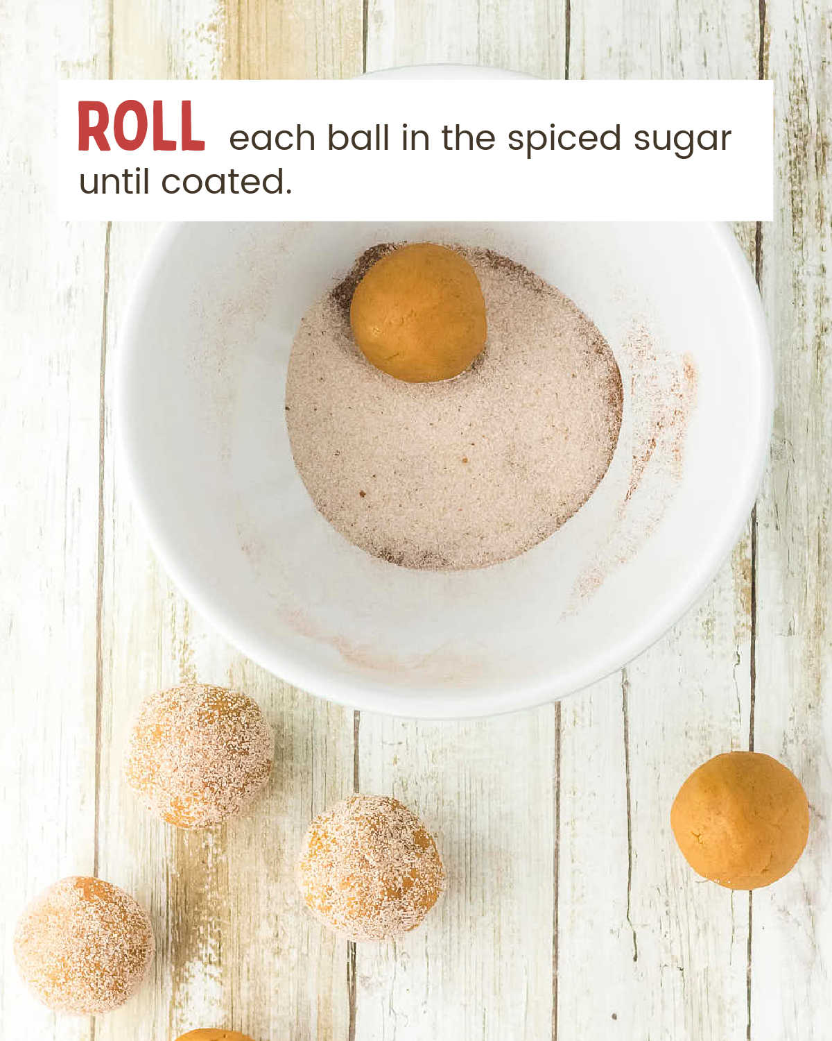 A pumpkin dough ball rolled in the pumpkin spice sugar coating.