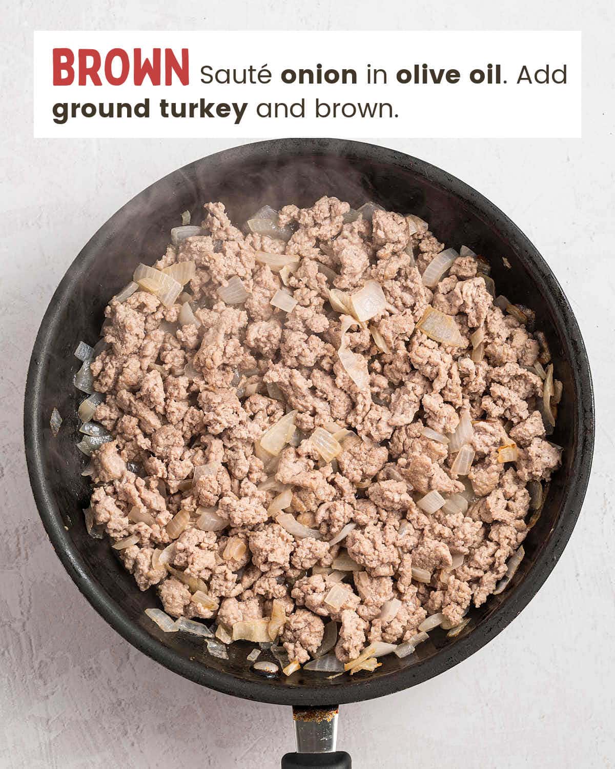 Browned ground turkey and onion in a skillet for Crockpot Ground Turkey Chili.