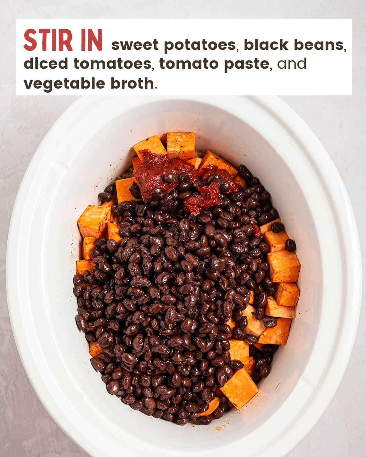 Black beans, sweet potato cubes and tomato paste added to the slow cooker for Crockpot Ground Turkey Chili.