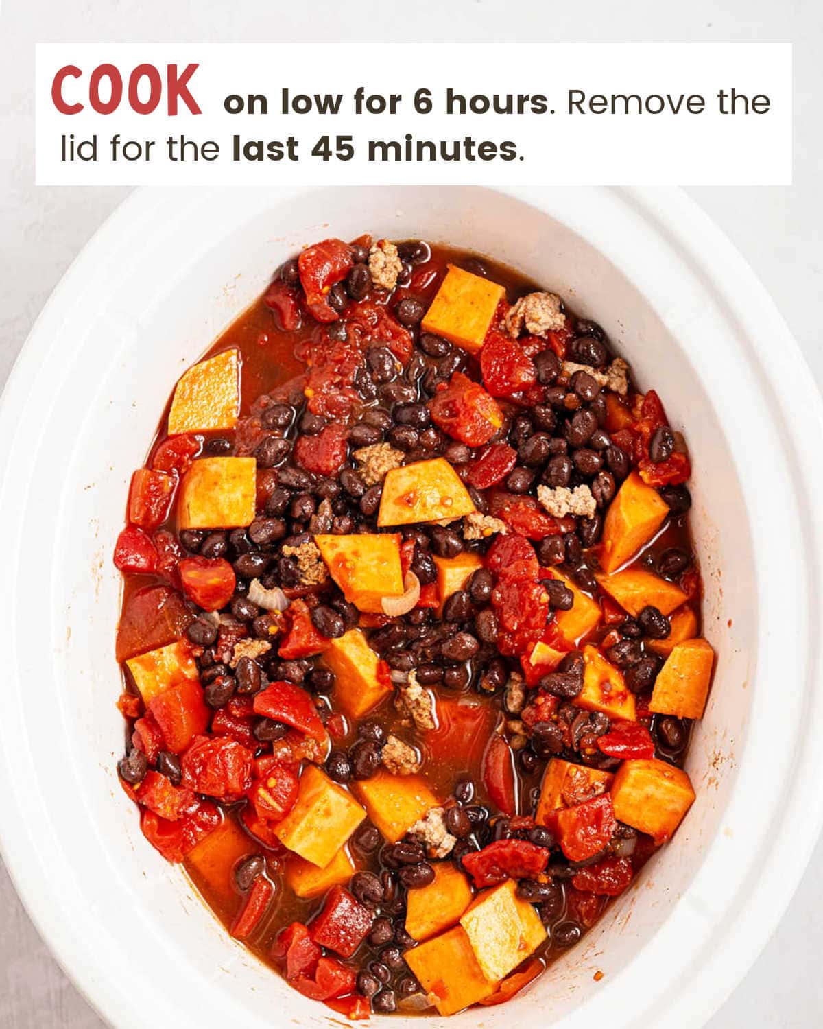 Diced tomatoes and broth stirred into the slow cooker for Crockpot Ground Turkey Chili.