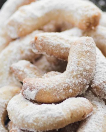 A plate of freshly baked almond crescent cookies also known as Vanillekipferl