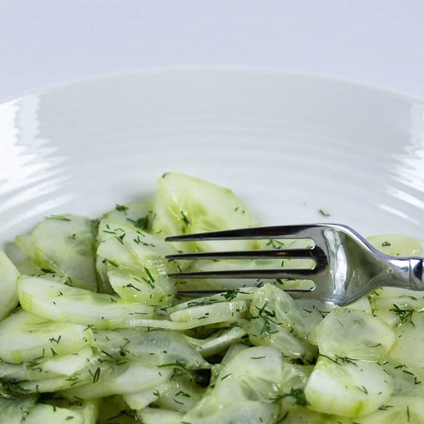 a bowl of authentic German cucumber salad