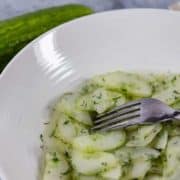 a bowl of authentic German cucumber salad