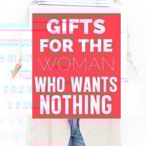 Woman being surprised by a stack of gifts