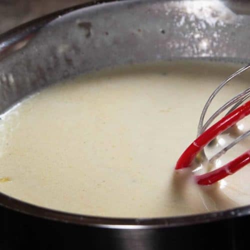 Whisking Alfredo Sauce