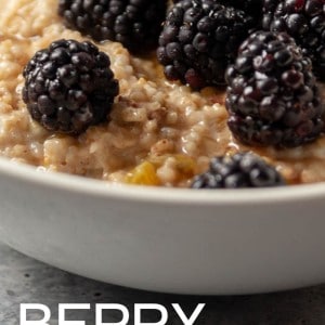 A delicious berry oatmeal recipe! A bowl with cooked steel cut oats and fresh berries