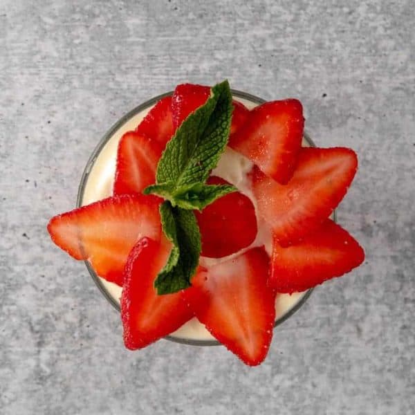 A bowl of beautifully garnished creamy strawberry pudding. Simply Delicious