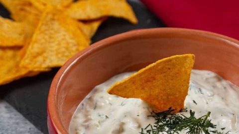 Dill Dip in a bowl served with gluten free sweet potato crackers