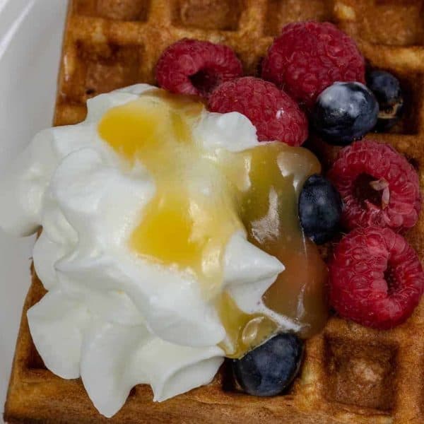 Gluten Free Waffles with Blueberries and Raspberries with Whipped Cream and Lemon Turd