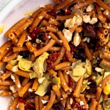 Learn how to make a gluten free lentil pasta salad in under 15 minutes. This delicious gluten free pasta salad is a perfect option for lunch or dinner.