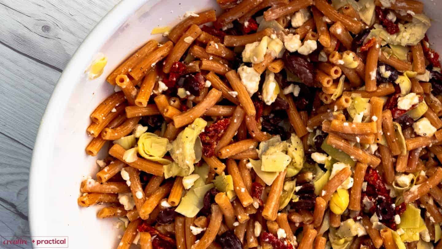 Learn how to make a gluten free lentil pasta salad in under 15 minutes. This delicious gluten free pasta salad is a perfect option for lunch or dinner.