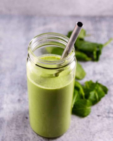 Kale Banana Smoothie served in a wide mouth smoothie glass