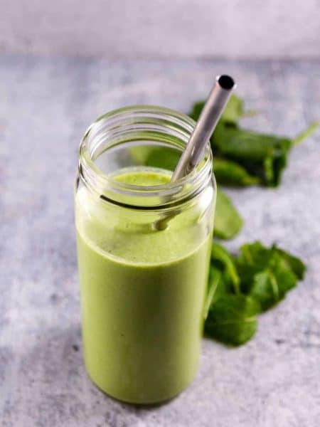 Kale Banana Smoothie served in a wide mouth smoothie glass