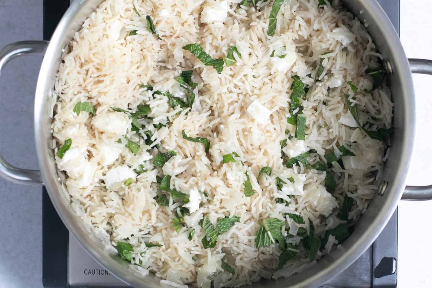 A pot filled with the best easy mint and feta rice